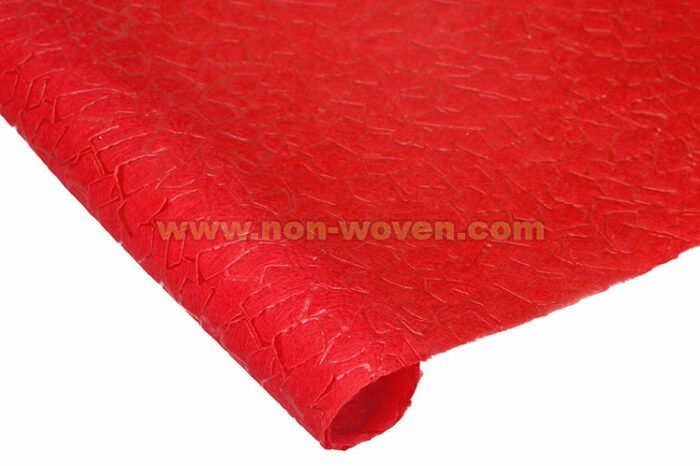 Red wrapping paper nonwoven